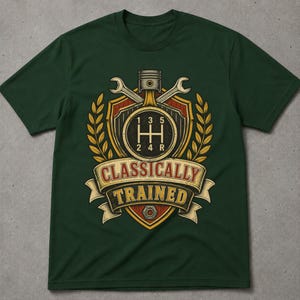 May include: A dark green short-sleeve t-shirt featuring a graphic print of a car gear shift pattern, a piston, and two wrenches arranged on a shield. The design includes yellow wheat stalks and a banner with the text "CLASSICALLY TRAINED".