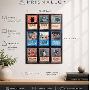 May include: A black rectangular display frame for trading cards, measuring 8 inches by 12 inches. The frame holds nine individual cards in a grid layout. The text PRISMALLOY is visible at the top and bottom, with additional text describing features.