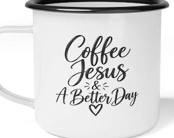 May include: A white enamel mug with a black rim and handle. The front features black cursive text that reads Coffee Jesus & A Better Day, accented with small decorative lines and a heart symbol centered below the text.