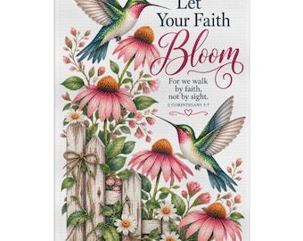 May include: A rectangular white kitchen towel featuring two hummingbirds, pink coneflower blossoms, and a wooden fence. The text reads: Let Your Faith Bloom. For we walk by faith, not by sight. 2 Corinthians 5:7 with a small heart icon.