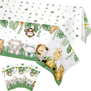 May include: White tablecloth with a jungle animal theme, featuring illustrations of a monkey, elephant, hippo, lion, zebra, giraffe, and tiger. Green and brown foliage accents the design. Includes matching party favor bags.