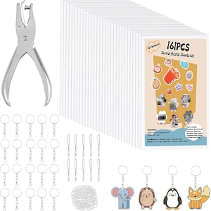 May include: A shrink plastic sheets kit containing 161 pieces, including a silver metal hole puncher, numerous clear plastic sheets, metal key rings with lobster clasps, black lanyard cords, and small jump rings, plus four illustrated animal charms.