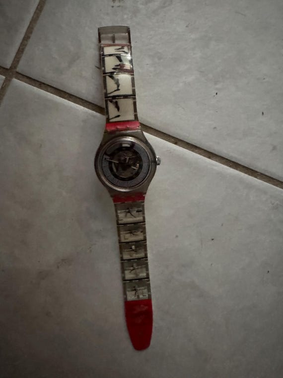 Swatch watch. Edwin Moses.  Automatic ,no batteries ever. Dude running