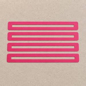 May include: Four bright pink rectangular shapes arranged horizontally on a neutral background. The shapes are evenly spaced and have rounded corners, creating a modern, minimalist design. The vibrant colour contrasts with the background.