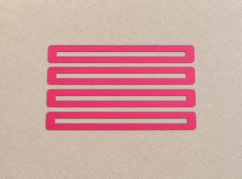 May include: Four bright pink rectangular shapes arranged horizontally on a neutral background. The shapes are evenly spaced and have rounded corners, creating a modern, minimalist design. The vibrant colour contrasts with the background.