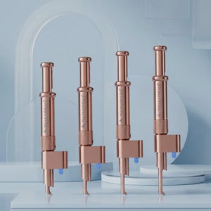 May include: Four rose gold metal devices arranged in a row, each featuring a cylindrical body with a plunger top, a textured grip section, and a side-mounted component with a small blue tip. The word BUMPSKE is engraved vertically on each unit.