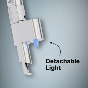 May include: A silver-colored metal tool attachment featuring a small, blue, detachable LED light component. The device has a cylindrical body with a textured grip section and a curved, pointed tip. The text Detachable Light is visible.