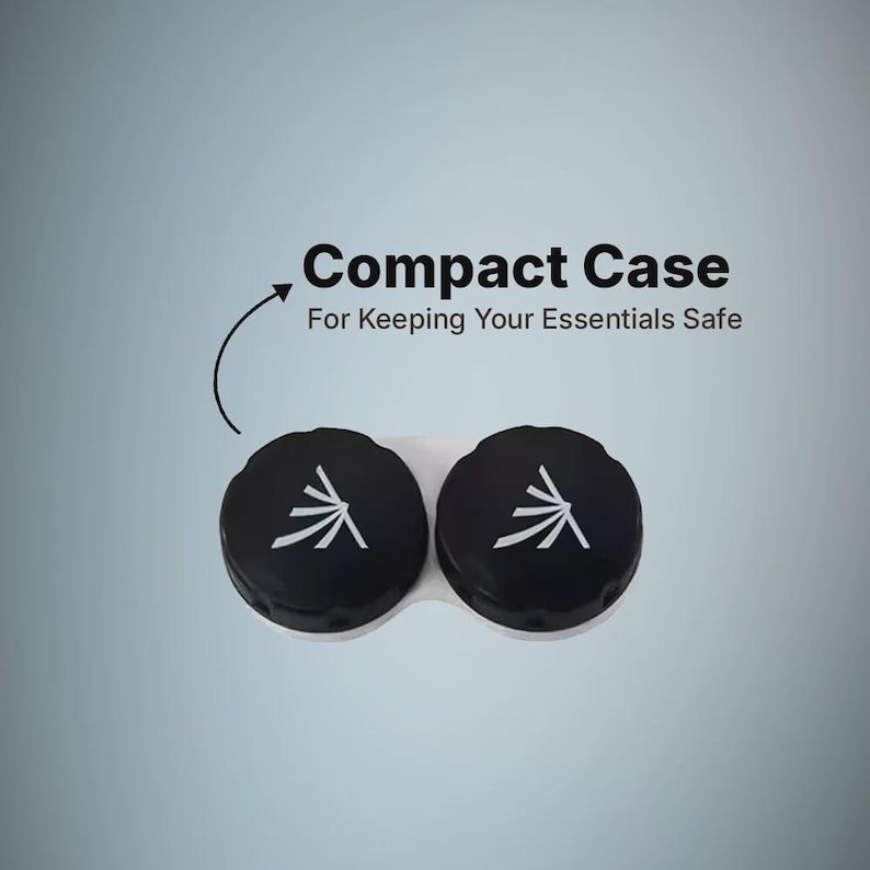 May include: A white contact lens case with two black screw-on caps, each featuring a white stylized graphic. Above the case, the text reads Compact Case For Keeping Your Essentials Safe, with an arrow pointing down toward the lens container.