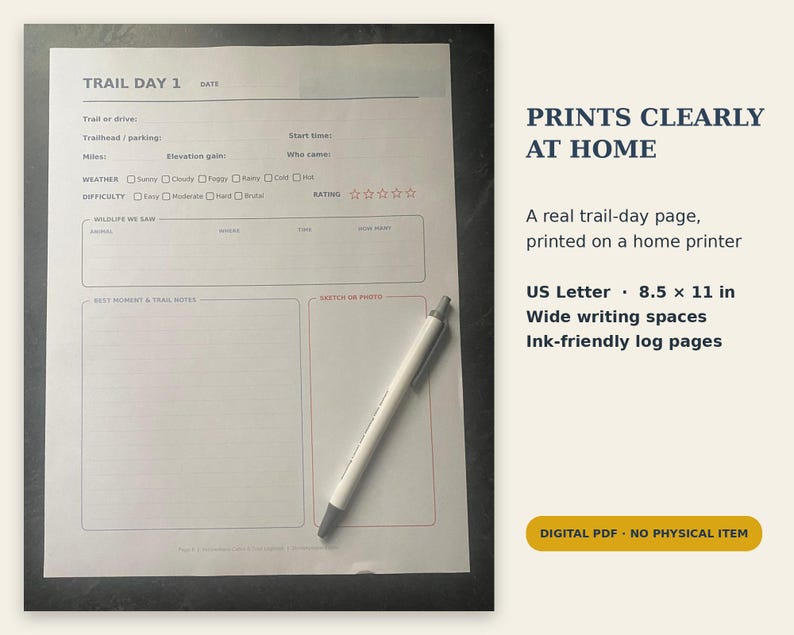 May include: A white US Letter 8.5 x 11 inch trail log sheet with black text and lines, featuring sections for trail details, weather, difficulty, wildlife, and notes. A white pen with a grey tip rests diagonally across the paper surface.