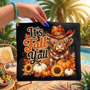 May include: A black square fabric item featuring a graphic of a Highland cow wearing a plaid cowboy hat and scarf, surrounded by pumpkins, sunflowers, and autumn leaves. The text reads It's Fall Y'all in orange and white stylized lettering.