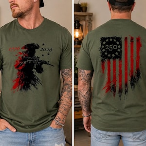 May include: An olive green t-shirt featuring a front graphic of a silhouette of a soldier with a rifle, the years 1776 and 2026, and stars. The back graphic displays a distressed American flag design with a circle of stars and the number 250.