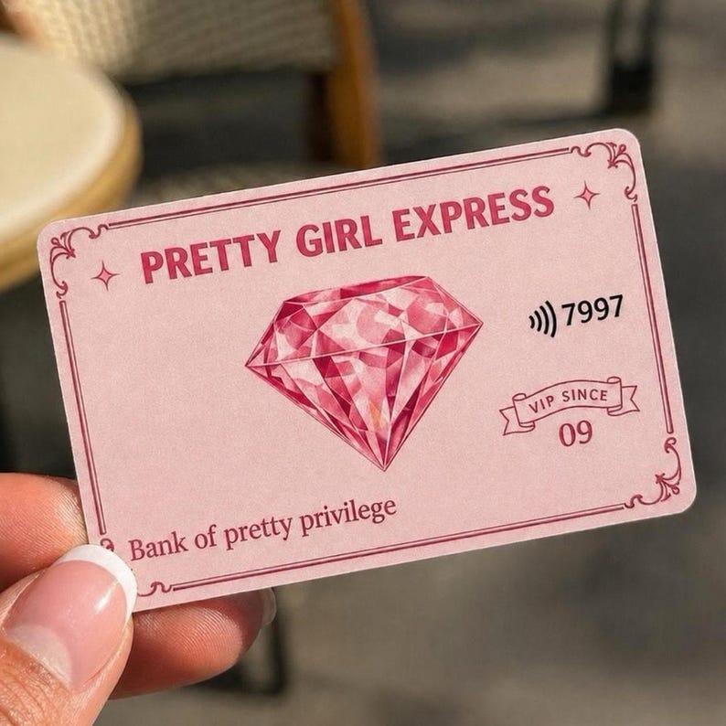 May include: A pink card with the text "PRETTY GIRL EXPRESS" and a large pink diamond illustration. The card also features the text "Bank of pretty privilege" and "VIP SINCE 09".