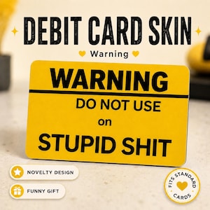May include: A yellow debit card skin with the text "WARNING DO NOT USE on STUPID SHIT". The design includes the words "DEBIT CARD SKIN" and "Warning". The skin is labeled as a novelty design and a funny gift.