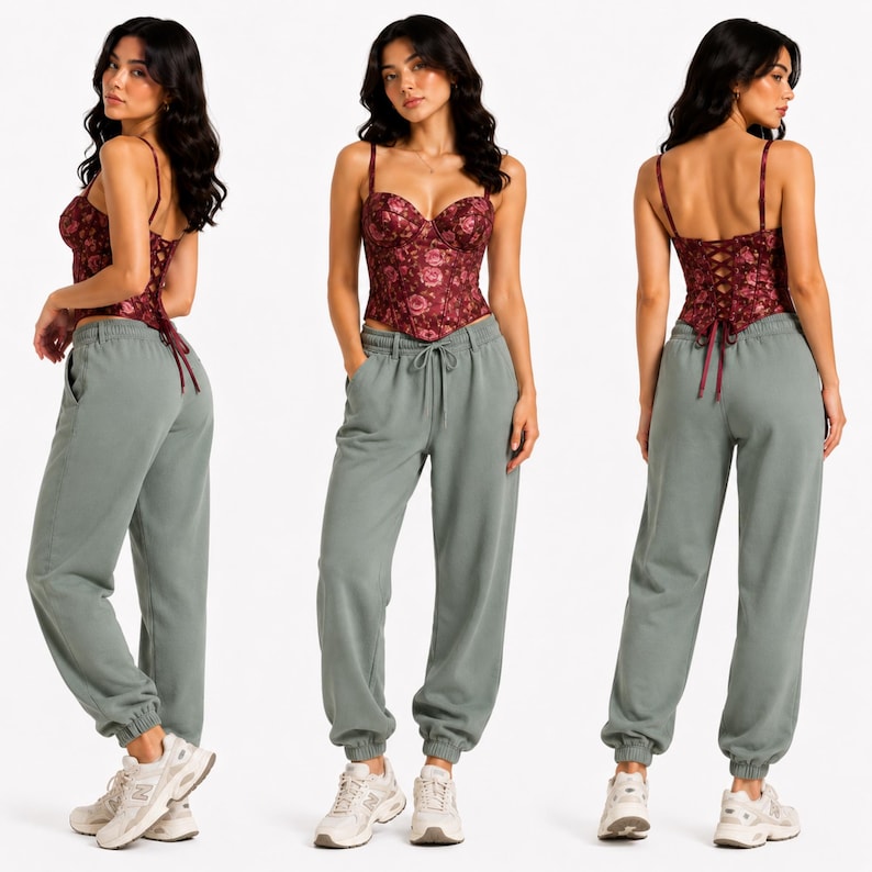 May include: A burgundy floral print corset top with spaghetti straps and a lace-up back. Paired with sage green sweatpants with a drawstring waist and elastic cuffs. The outfit is completed with white sneakers.