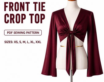 Puede incluir: Un top corto burdeos con lazo frontal y mangas largas acampanadas, exhibido en un maniquí. El top presenta un escote en V profundo y un cierre de lazo en la cintura. El texto de la imagen dice "FRONT TIE CROP TOP" y "PDF SEWING PATTERN". Tallas: XS, S, M, L, XL, XXL.