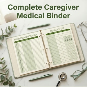 May include: A light green three-ring medical binder open to pages titled Blood Pressure Tracker and Medication List. The binder includes columns for date, time, systolic and diastolic readings, dosage, frequency, and notes. A pen and stethoscope are present.