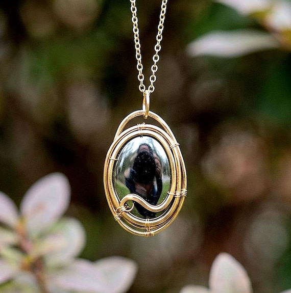 Oval Shungite Wire Wrapped Pendant In Raw Brass 18 Inch Gold Over Brass Chain