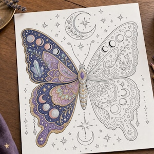 May include: A detailed butterfly coloring page with celestial and geometric designs. One wing is colored with purple, blue, and gold hues, while the other is a line drawing. The image includes stars, moons, and crystals.