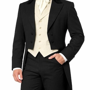 May include: A black tailcoat jacket with a velvet collar, worn over a cream-colored waistcoat with buttons and a white cravat. The ensemble includes matching black trousers, creating a formal outfit with a long-tailed coat design and structured lapels.