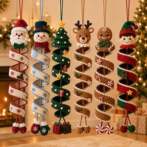 May include: Six hanging crochet Christmas ornaments featuring a Santa Claus, a snowman, a Christmas tree, a reindeer, a gingerbread person, and an elf. Each figure is attached to a long, spiraling crochet ribbon decorated with festive motifs.