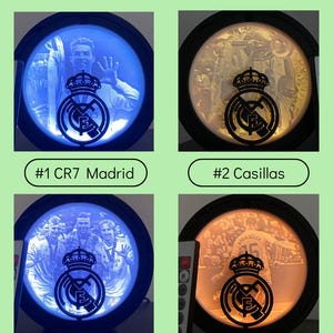 Puede incluir: Cuatro l&aacute;mparas LED redondas con el logo del Real Madrid e im&aacute;genes de jugadores. Las l&aacute;mparas tienen un marco negro y est&aacute;n etiquetadas con nombres y n&uacute;meros de jugadores. El texto "Led Lamp" y "2Y PRINTS Choose design" est&aacute;n en la parte superior.