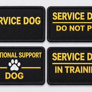 May include: Four black rectangular patches with yellow embroidered text. The patches read: "SERVICE DOG", "SERVICE DOG DO NOT PET", "EMOTIONAL SUPPORT DOG" with a paw print, and "SERVICE DOG IN TRAINING".