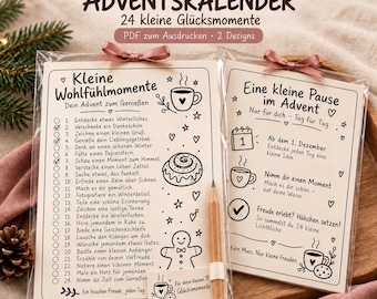 May include: Two printable advent calendar cards in clear plastic sleeves with pink ribbon bows. The cards feature black text and line art illustrations of coffee cups, a cinnamon roll, and a gingerbread man, with a wooden pencil attached.