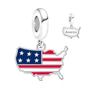 May include: A silver charm bead featuring a dangling pendant shaped like the map of the United States. The front is filled with red, white, and blue enamel in a flag pattern with six white stars. The back of the pendant is engraved with the word America.