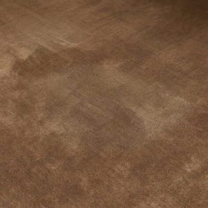 May include: A close-up shot of a brown, textured fabric. The fabric has a soft, velvety appearance with subtle variations in color and tone, creating a sense of depth and dimension. The surface appears to be smooth with a slight sheen.