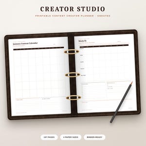 May include: An open dark brown binder with gold rings containing a printable content creator planner. The left page shows a January content calendar, while the right page displays a weekly planner layout with a black pencil resting on top.