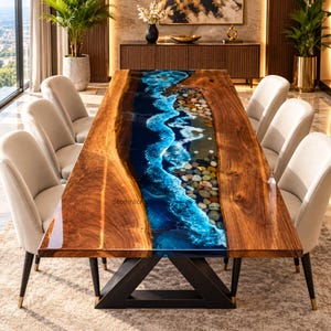 May include: A rectangular dining table featuring a live-edge wood slab with a central river design made of blue resin, white foam effects, and embedded river stones. The table is supported by a black metal base and surrounded by six beige chairs.