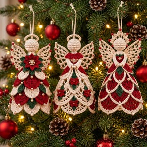 May include: Three handcrafted crochet angel ornaments in cream, red, and green yarn. Each angel features intricate lace wings, a round head, and a layered skirt adorned with small white beads and floral motifs, suspended by a white string.