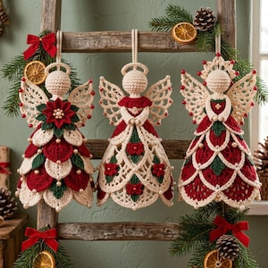 May include: Three crocheted angel ornaments hanging from a wooden ladder. Each angel features cream, red, and green yarn with small white beads. The angels have intricate lace-like wings, detailed skirts with floral motifs, and halos. The ladder is decorated with pine branches, dried orange slices, and red bows.