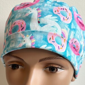 Flamingos, Unicorns, Donuts and Floaties in the Swimming Pool - Adjustable, Fold Up Scrub Hat.