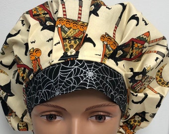 May include: A surgical scrub hat with a black and white spiderweb pattern on the inside and a black cat and pumpkin design on the outside. The hat is made of a soft, comfortable fabric and is perfect for nurses, doctors, and other healthcare professionals.