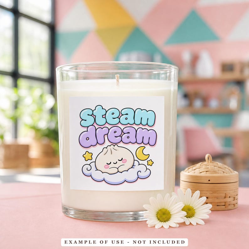 A clear candle in a glass jar with a label featuring a sleeping dumpling on a cloud, with the text "STEAM dream" above it.