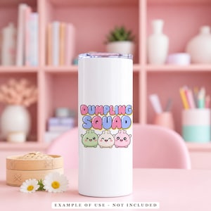 A white tumbler with the text "DUMPLING SQUAD" above three smiling, pastel-colored dumpling characters.