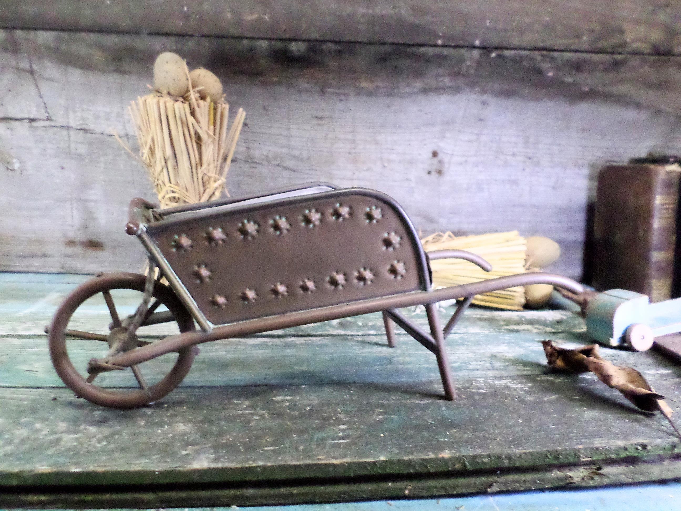 Antique metal wheelbarrow deals