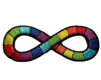 May include: Rainbow colored infinity symbol embroidered patch. The patch is black outlined and has a rainbow pattern of red, orange, yellow, green, blue, indigo, and violet.