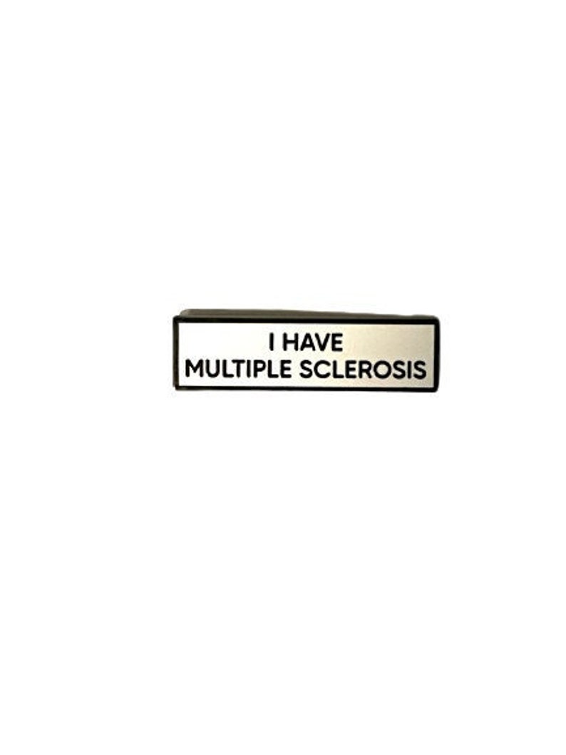 May include: Black and white sign with the text "I have Multiple Sclerosis" on a white background.