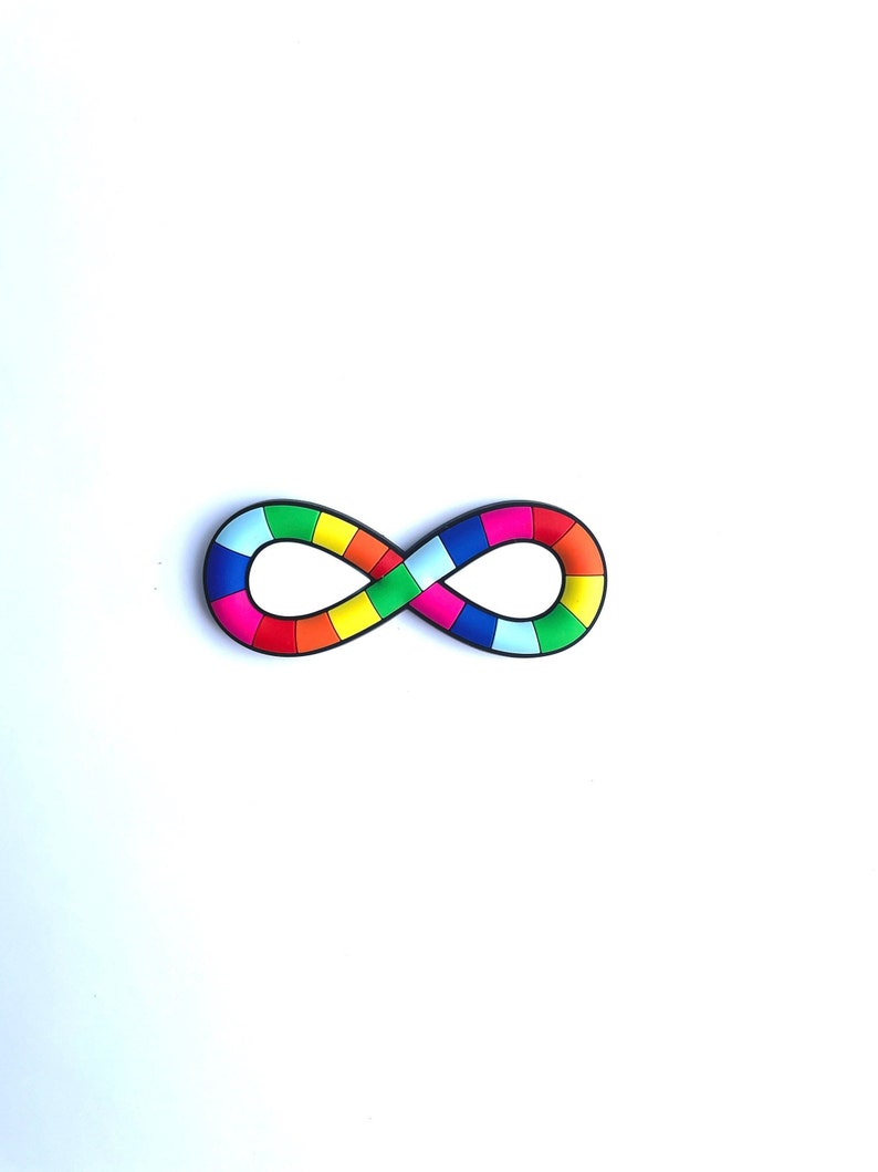 May include: A colorful infinity symbol with a black outline. The symbol is composed of various colored squares, including red, orange, yellow, green, blue, and pink. The design is set against a plain white background.