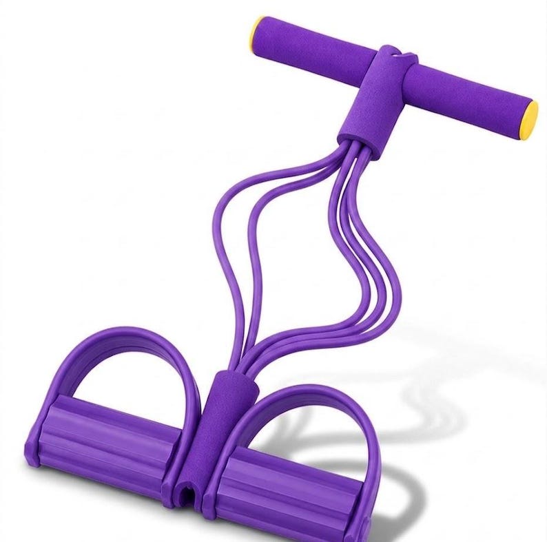 May include: A purple resistance exercise tool featuring a T-shaped handle with yellow end caps and two foot pedals connected by four elastic tubes. The handles and pedals are covered in a textured foam material for grip during physical activity.