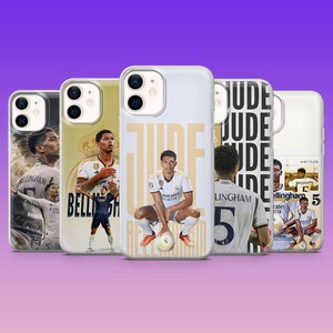 May include: Five smartphone cases featuring Jude Bellingham in various poses and team uniforms. The designs include the player in white and dark kits, with text overlays reading JUDE, BELLINGHAM, and the number 5, set against a purple background.