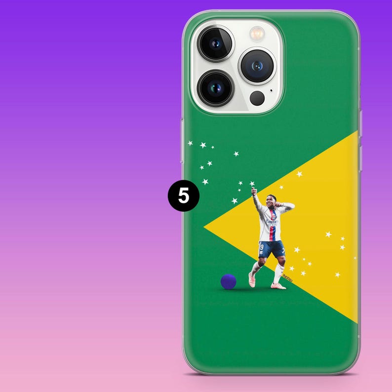 May include: A green and yellow smartphone case featuring a graphic of a soccer player in a white and blue uniform celebrating with arms raised. A small purple ball sits near the player, and white stars are scattered across the design.