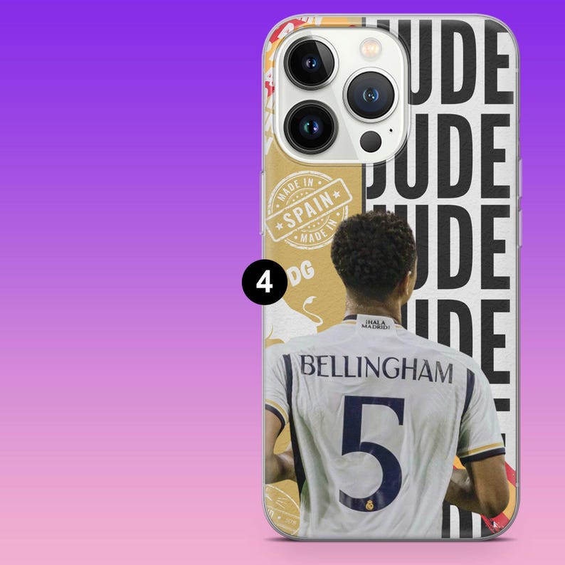 May include: A smartphone case featuring a graphic of a footballer wearing a white jersey with the name BELLINGHAM and the number 5 on the back. The design includes the repeated text JUDE, a circular stamp reading MADE IN SPAIN, and a small number 4.