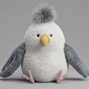 May include: A plush seagull toy with a fluffy white body, gray wings, and a gray tuft on its head. It has a yellow beak and pink feet. The toy is designed to sit upright.