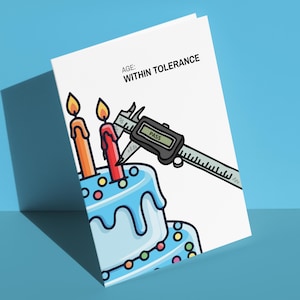May include: A white greeting card featuring a cartoon illustration of a light blue birthday cake with colorful sprinkles and two lit candles. A digital caliper measures one candle, with the screen displaying the text PASS. Text reads AGE: WITHIN TOLERANCE.