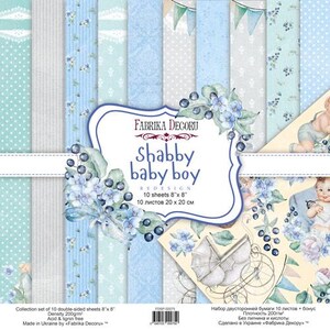 May include: A collection of 10 double-sided scrapbook paper sheets titled Fabrika Decoru Shabby Baby Boy. The set features light blue, cream, and grey patterns including polka dots, stripes, and floral motifs, measuring 20 cm by 20 cm.