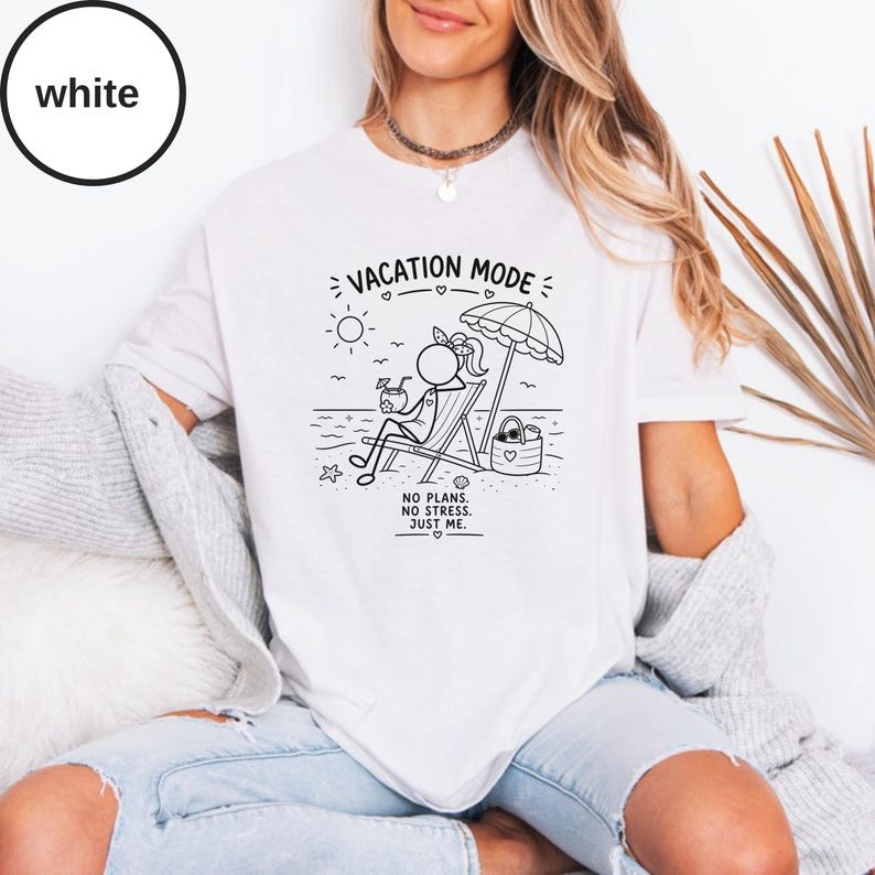 May include: White t-shirt with a black graphic of a stick figure relaxing on a beach chair under an umbrella. The text "VACATION MODE" and "NO PLANS. NO STRESS. JUST ME." are also printed on the shirt.