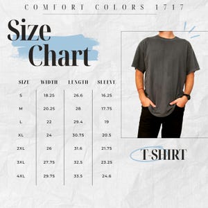 May include: A size chart for a Comfort Colors T-shirt, with measurements in inches for sizes S through 4XL. The chart includes width, length, and sleeve measurements. A person is wearing a gray T-shirt in the image.